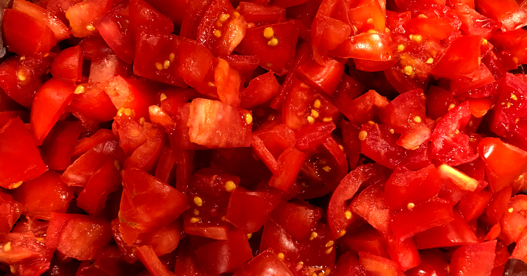 Tomatoes prepared to be used for Bruschetta. Tomatoes cut into 1 inch pieces.