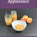 Pinterest Pin for How to Water Bath Can Applesauce from sowmanyplants.com. Image of two mason jars of applesauce, a white bowl full of applesauce, and three apples.