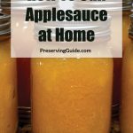 Pinterest Pin for How To Can Applesauce at Home. Image of mason jars of applesauce after being water bath canned.