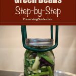 Pinterest Pin for How To Can Green Beans Step-by-Step. Image of a mason jar of green beans before being pressure canned.