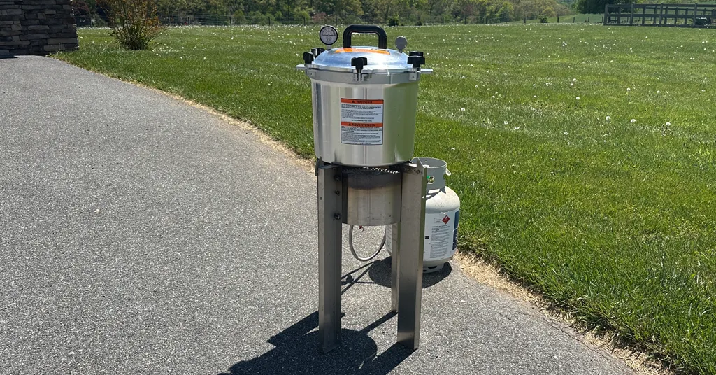 All American Pressure Canner on an outdoor propane burner.