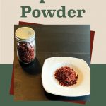 Pinterest Pin for How to Dehydrate Paprika Powder. Image of dehydrated paprika powder in a small spice jar and sitting on a white plate on a dark surface.