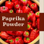 Pinterest Pin for Making Paprika Powder. Image of red paprika peppers in a wooden bowl.