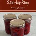 Pinterest Pin for How To Can Beets Step-by-Step. Image of three mason jars of pressure canned beets sitting on a painted surface