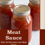 The image showcases three jars filled with meat sauce, sealed with metal lids, placed on a white surface. The design features a beige background with brown accents. The text "Meat Sauce" is prominently displayed in large brown letters in the center, with "How To Pressure Can Meat Sauce" written underneath in a smaller font. At the bottom of the image, "PreservingGuide.com" is included in a brown font, framed by a border that matches the text. The overall design emphasizes the process of pressure canning meat sauce at home.