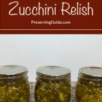 The image shows three jars of zucchini relish with sealed metal lids, neatly arranged on a speckled countertop. The relish has a vibrant green color, reflecting the freshness of the ingredients. Above the jars, there is a brown banner with white and light brown text that reads: "How To Can Zucchini Relish." Below this, the text "PreservingGuide.com" is displayed.