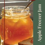 This image features a close-up of a jar of golden apple freezer jam with a spoon inside, placed next to a slice of bread spread with the same jam. The natural lighting from a nearby window adds a warm, inviting glow. The accompanying text, "Tips & Tricks" and "Apple Freezer Jam," suggests useful advice or a guide on making this jam. The layout emphasizes the simplicity and homemade nature of the apple jam, making it appealing to home preservers.