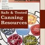 The image shows a close-up of the "USDA Complete Guide to Home Canning," a spiral-bound guide covering various principles and methods of home canning. Overlaid on the image is a bold, brown text box that reads "Safe & Tested Canning Resources." At the bottom, the text "PreservingGuide.com" is displayed on a beige background, providing a trustworthy source for canning information and resources. The overall design uses an earthy color palette to emphasize reliability and safety in canning practices.