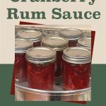 This image showcases jars of homemade cranberry rum sauce on a canning rack, freshly sealed and cooling. The overlay text reads "How To Can Cranberry Rum Sauce," presented on a split-color background with a jar icon at the bottom, emphasizing the preservation theme of this homemade treat.