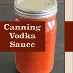 This image presents a close-up of a jar of vodka sauce, sealed and positioned on a dark surface. The overlay text reads "Canning Vodka Sauce," prominently displayed on a bold background, with "PreservingGuide.com" at the bottom, indicating the source for canning tips and recipes. The design highlights the home preservation process for this homemade sauce.