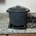 Ganiteware water bath canner sitting on a propane stove.