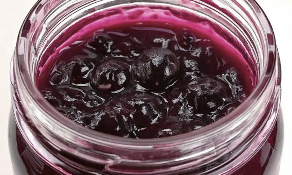 Blueberry Pie Filling in a glass mason jar.