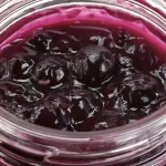 Blueberry Pie Filling in a glass mason jar.