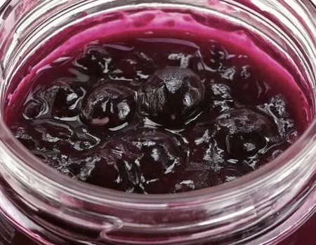 Blueberry Pie Filling in a glass mason jar.