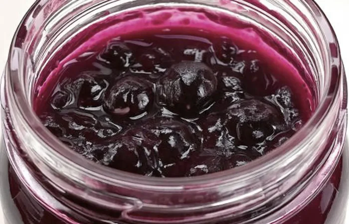 Blueberry Pie Filling in a glass mason jar.