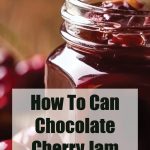 This image shows an open jar of chocolate cherry jam with rich, glossy texture and chunks of cherries visible. Overlaid on the image, text reads: "How To Can Chocolate Cherry Jam" with "PreservingGuide.com" listed below. The background features blurred cherries and a rustic wooden setting, emphasizing the homemade and natural theme.