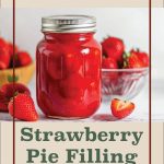 A mason jar filled with vibrant red strawberry pie filling sits on a white surface, sealed with a silver lid. Fresh strawberries surround the jar, with a bowl of strawberries in the background and a sliced strawberry in the foreground. The design includes a beige background with brown text reading 'Water Bath Canning Strawberry Pie Filling,' framed by a thin brown border, and a small jar logo centered at the bottom.